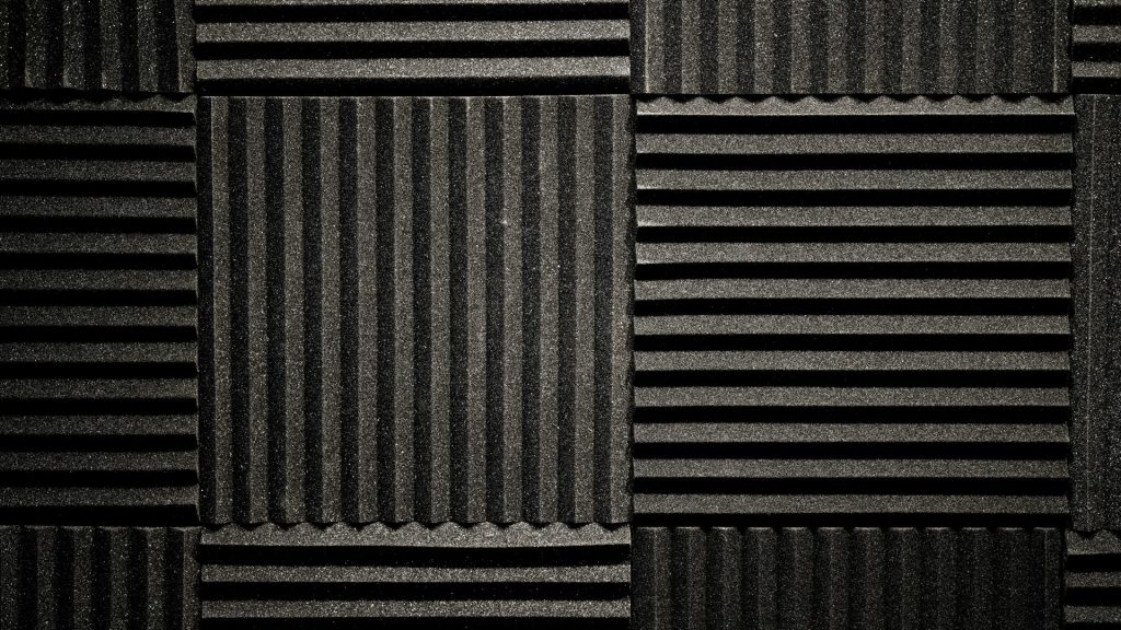 a black and white photo of a wall made of corrugated